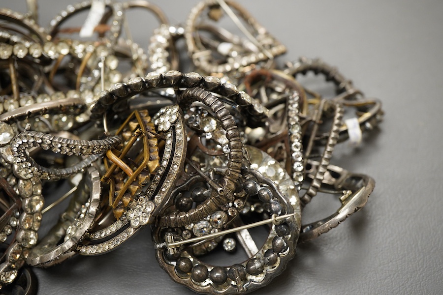 A large collection of buckles, 18th-19th century, of oval and rectangular outline, set with pastes mostly mounted in steel, a minority in silver, some with later brooch fittings